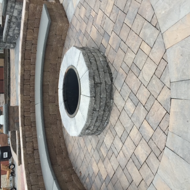 hardcaping backyard with firepit and seating