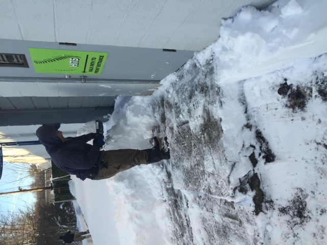 person salting snow